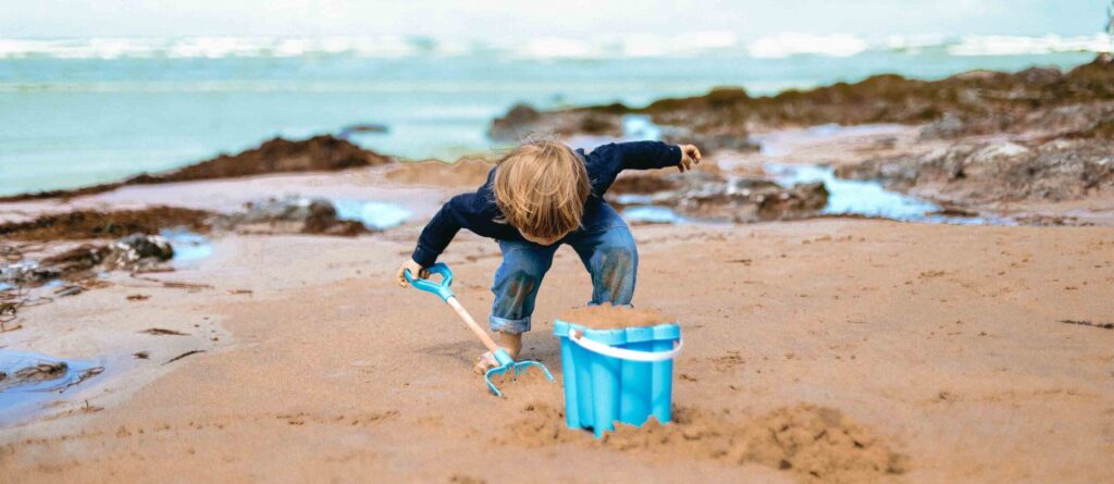 Child playing with the sand.
