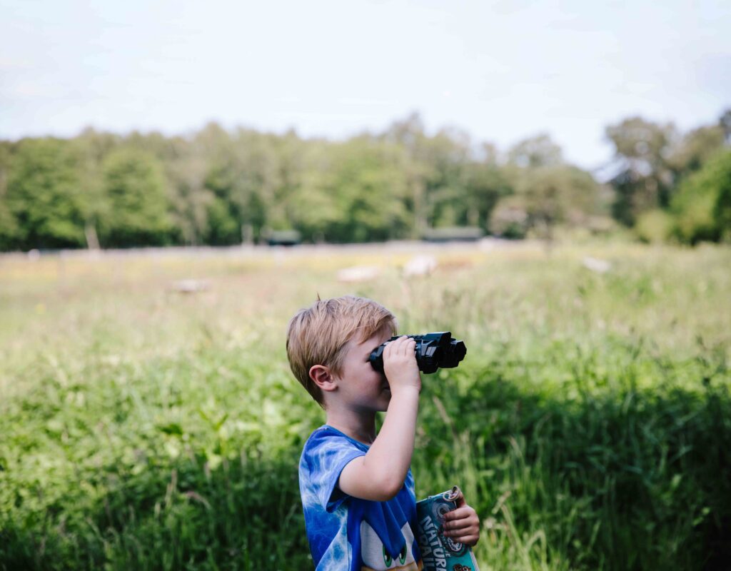 Child with binoculars.
