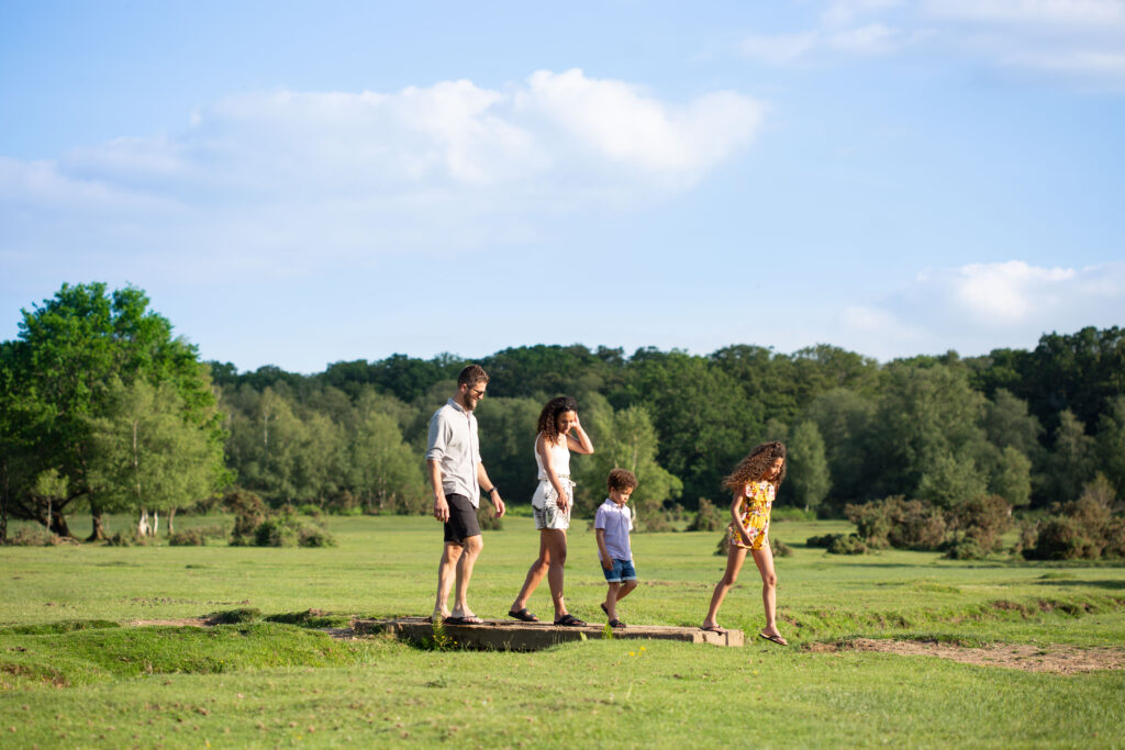 Family walking in a field.