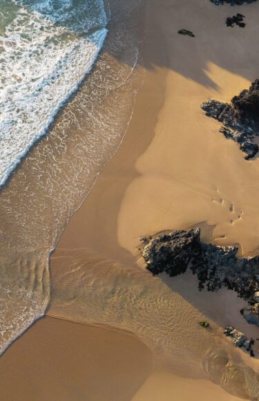 Holywell-Bay-Aerial-AdobeStock_1545965489-1920x2800-1-scaled