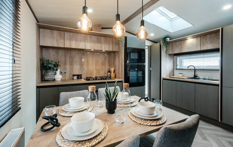 Contemporary kitchen with dining area in Lovat Parks holiday home.