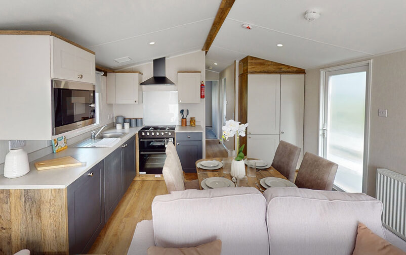 Contemporary holiday home interior with kitchen and dining area at Lovat Parks.