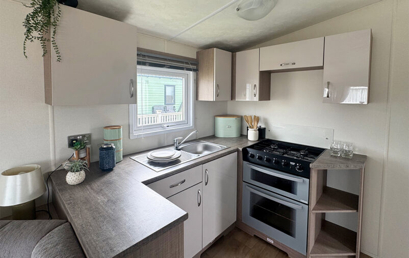 Cozy kitchen in Lovat Parks holiday home with modern appliances.