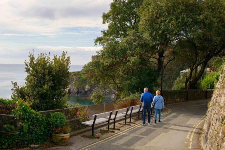 People standing by a bench.