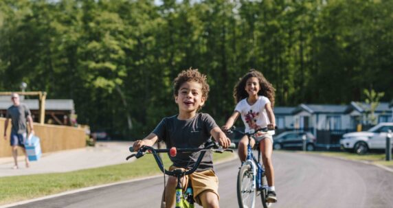 Kids cycling on a path.