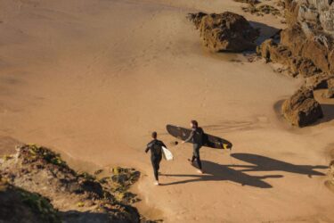 Surfers on Mawgan Porth beach