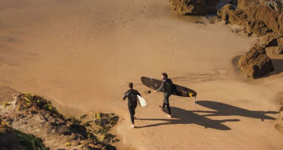 Surfers on Mawgan Porth beach