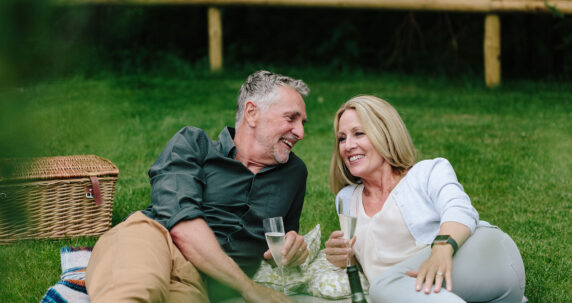 Couple enjoying champagne on a staycation