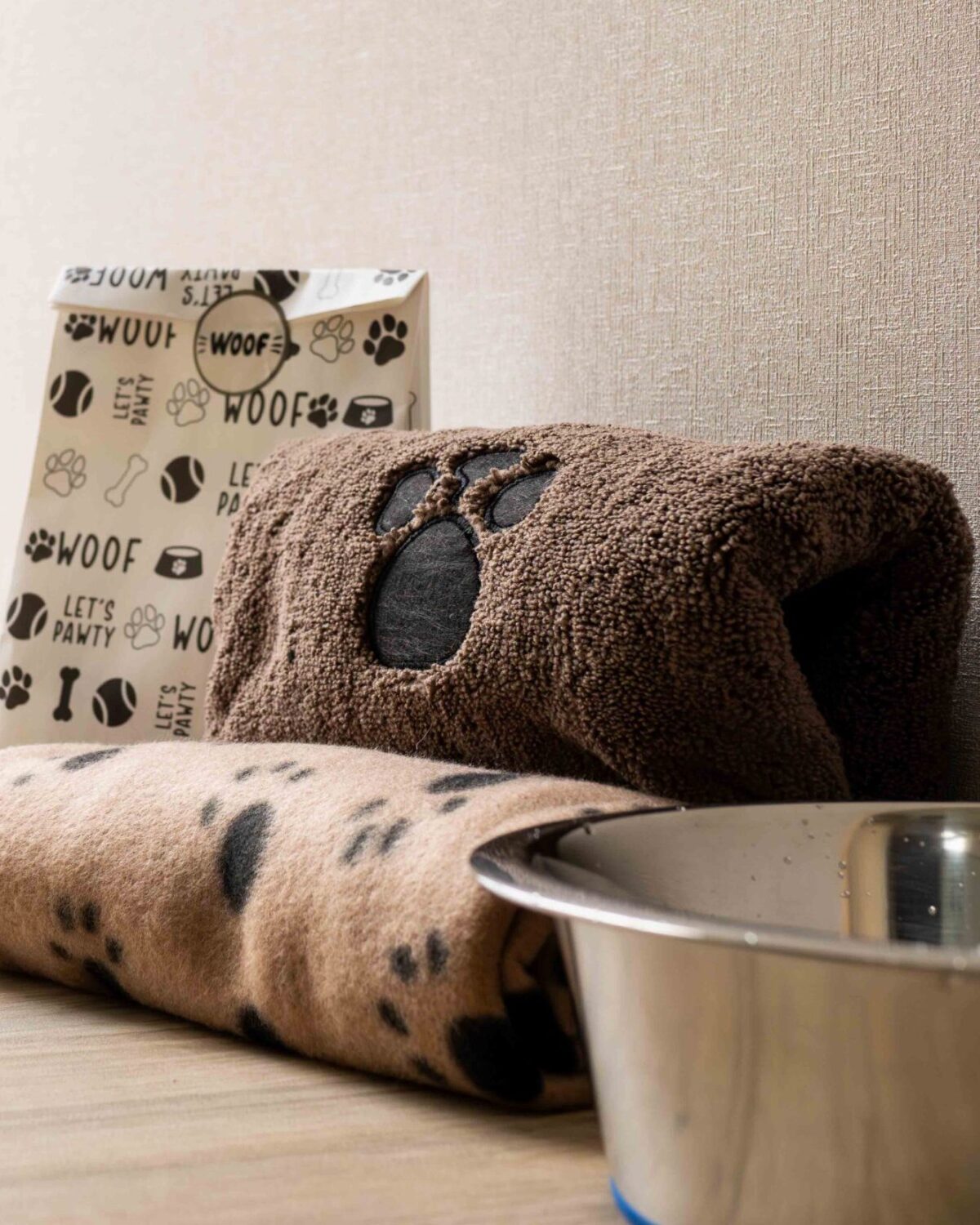 Dog bowl with blanket and treats.