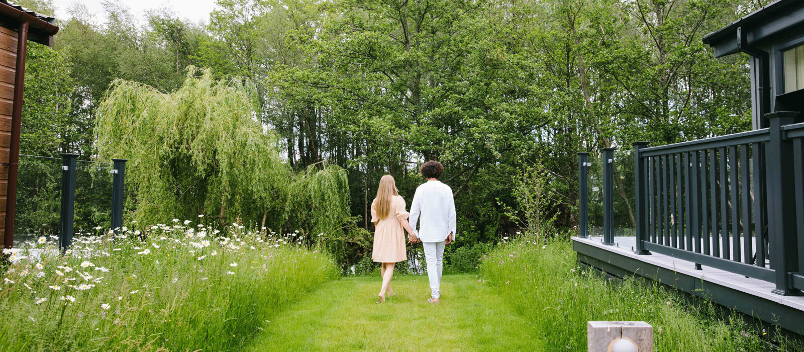 Two people walking down a path.